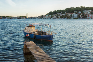 fishing boats moored at the pier in harbour of Mali Losinj town, Croatia.