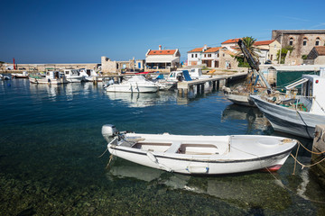 Fototapeta na wymiar fishing boats moored at the pier in harbour of Mali Losinj town, Croatia.