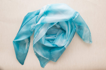 close up of hand colored blue silk scarf