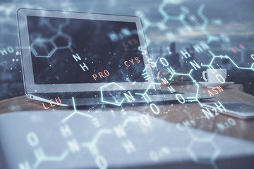 Desktop computer background and formula hologram writing. Double exposure. Education concept.