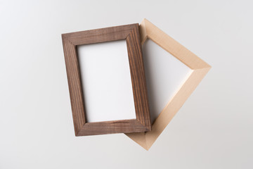 top view of two brown wood photo frame on white