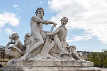 Fototapeta na wymiar Sculpture in Jardin des Tuileries Tuileries garden - favorite spot for rest of tourists and Parisians. Garden was created by Catherine de Medici in 1564. Paris, France