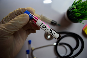 FSH - Test with blood sample. Top view isolated on color background. Healthcare/Medical concept