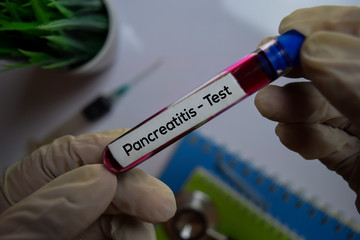 Obraz premium Pancreatitis - Test with blood sample. Top view isolated on office desk. Healthcare/Medical concept
