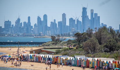 View from above of Brighton Beach huts in front of Melbourne Skyline