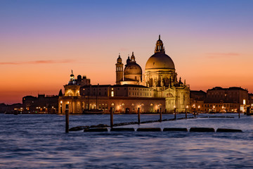 Fototapeta na wymiar Santa Maria della Salute (Saint Mary of Health) at sunset time, a Catholic church in Venice, Italy
