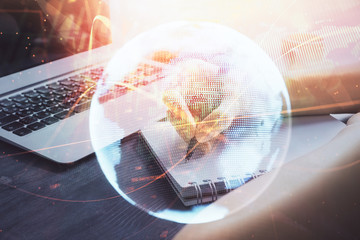 International business hologram over woman's hands taking notes background. Concept of success. Double exposure