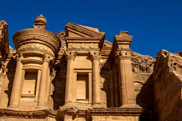 Sunny cloudless day close-up detailed view of the stunning Ad-Deir in the ancient city of Petra,...