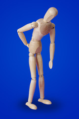 Wooden toy figure of patient - medical concept