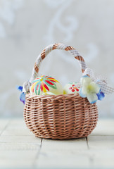 Fototapeta na wymiar Basket of Colorful Eggs for Easter
