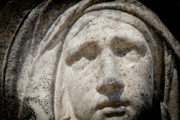 Close up ancient statue of Virgin Mary.