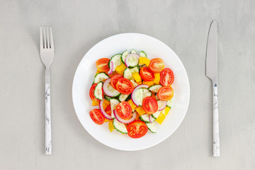 Green salad with tomato and fresh vegetables