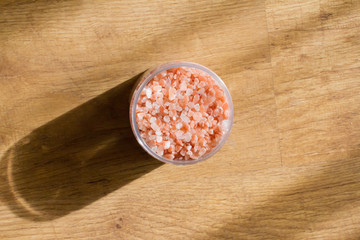 Himalayan salt. Bath salt. Spa treatment. The concept of the beauty and relaxation Industry. Bath of crystals in a transparent jar. The view from the top. Space for text.