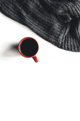 Autumn composition. Cup of coffee, sweater on white background. Autumn
