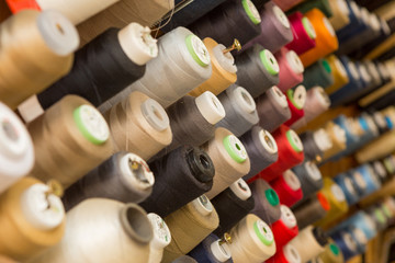 Many colorful spools of thread