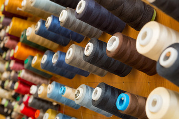 Many colorful spools of thread