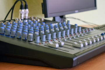 Mixing console with a computer in the studio