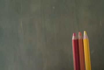 three colorful pencil, with red, orange and yellow