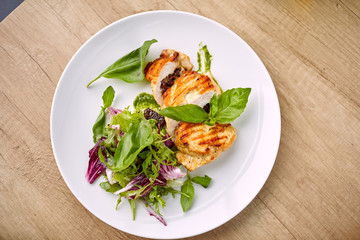 grilled chicken breast and salad