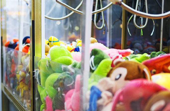 Mechanical claw game machine. Close-up view.