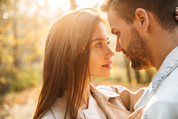 Beautiful young happy couple in love embracing