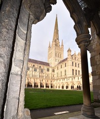 Fototapeta premium Cloisters and spire of Norwich Cathedral, in Norfolk, England, UK