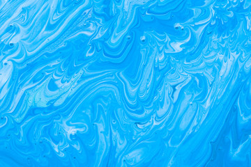 Fototapeta na wymiar Crystalline blue water acrylic pouring