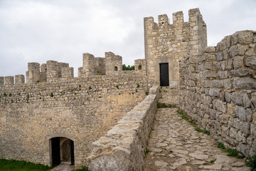 Fototapeta na wymiar View of the interior ruins of Sesimbra Castle on an overcast winter day