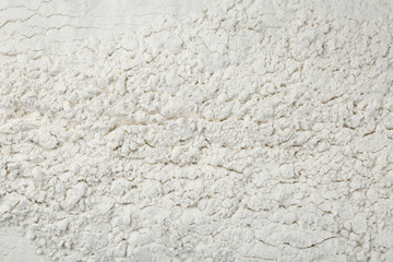 Pile of organic flour as background, top view