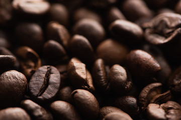 close up view of fresh roasted coffee beans background