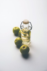 Obraz na płótnie Canvas Amla oil is a natural Ayurvedic oil used for hair health that contains extracts from the Indian gooseberry or Phyllanthus emblica