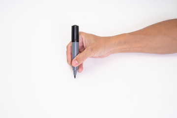 Man hand holding black magic marker pen writing on white background