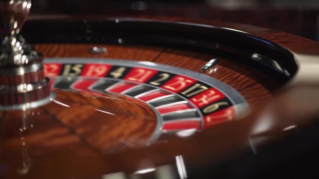Roulette in the casino spins and white ball