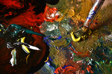 Artist mixing color oil painting on palette. Palette with paintbrush