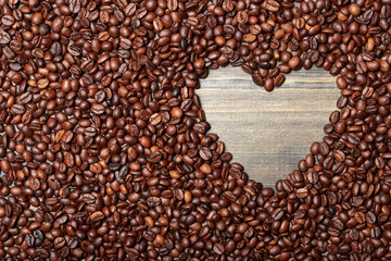 Roasted coffee beans. Heart shaped frame. View from above. ?opy space