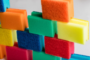 Dish washing sponges on a white background. A pile of sponges and rags, gloves for washing dishes on a white background.