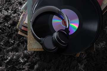 Beautiful vinyl records in a dark key very beautiful vintage artwork headphones for listening to music on records the old