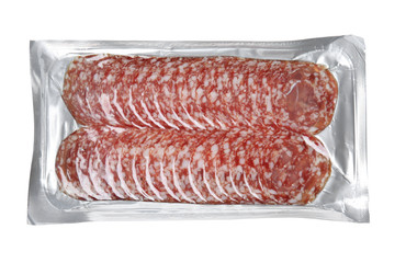 Slices of tasty sausage on white background, top view