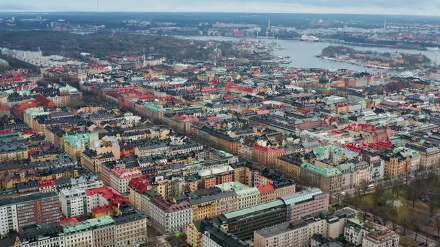 Drone flies forwards over buildings in Ostermalm, Stockholm. Aerial view of residential area, Sweden.