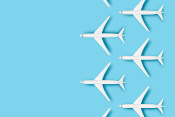 several airplanes on a blue background. Concept travel, airline tickets, flight, pallet route, transfer. Banner. Flat lay, top view