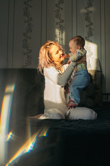 Naklejka premium Happy young mother with baby.