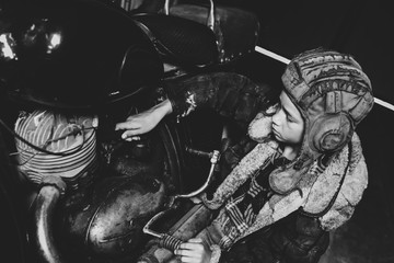 black and white portrait of a boy in a helmet