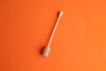 honey stick in color background