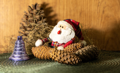 Christmas motifs featuring a Santa Claus surrounded by decorative ornaments for Christmas Day