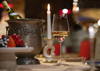 setting the table with wine for two in the evening in the restaurant