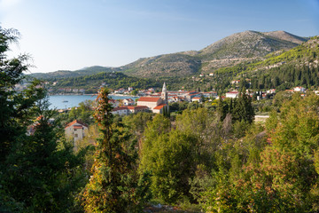 A small town in Croatia on the seafront with the Catholic Church.