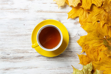Flat lay autumn composition with cup of black tea