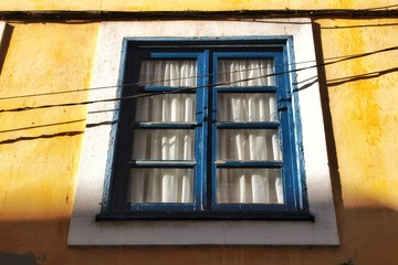 Old colorful typical facade next to the water canal in Aveiro village in Porto