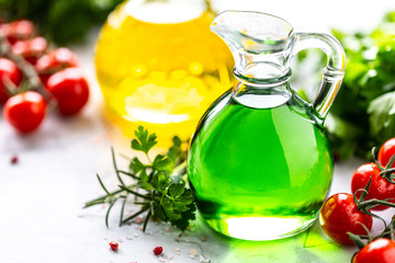 Different types of vegetable oil in glass bottles: sesame, linseed, grape oil. Horizontal