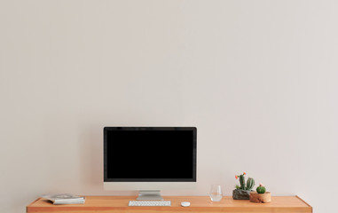 Close up television screen on the wooden table and white wall background, frame and vase of plant.